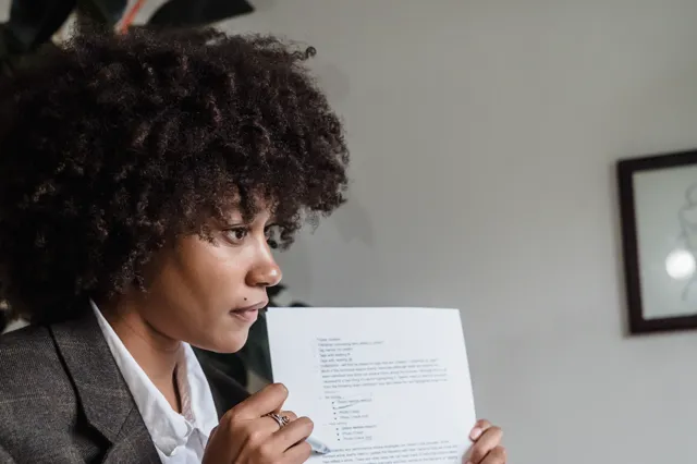 Woman reviewing a printed document